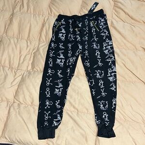 Women's Black Jogger Pants with funky stick figures and paper airplanes print